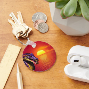 Cobra-orm med kraftig lila och gult nyckelring