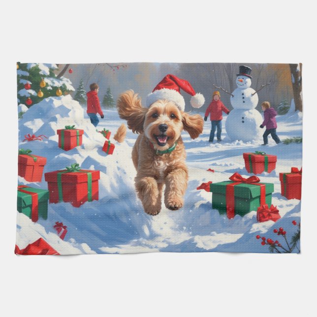 Cockapoo springar i snö med julhatt kökshandduk (Horisontell)