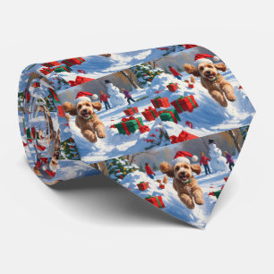 Cockapoo springer i snö med julhatt slips