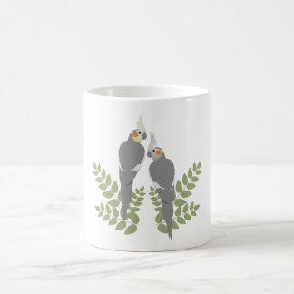Cockatielen kopplar ihop kaffemugg