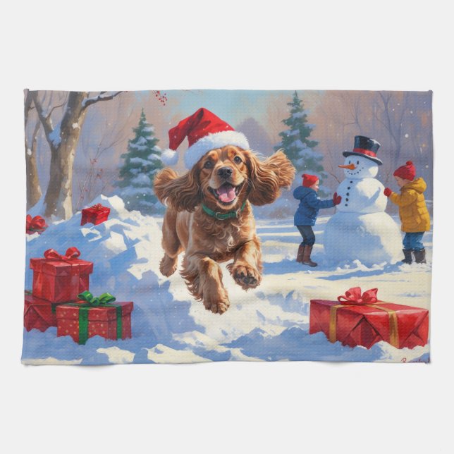 Cocker Spaniel springer i snö med julhatt Kökshandduk (Horisontell)