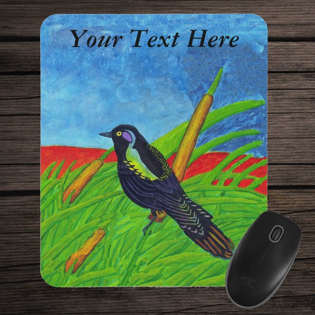 Colorful Black Bird Mousepad Musmatta (Colourful bird sitting in tall grass with yellow reed plants blue sky on mousepad.)