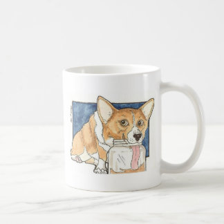 Corgi som slickar jordnötsmörburken kaffemugg