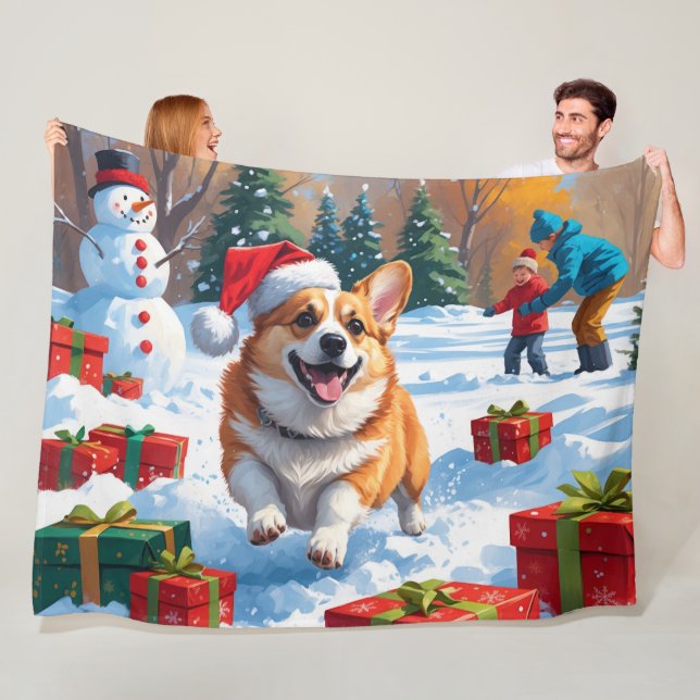 Corgi springer i snö med julhatt fleecefilt (På plats)