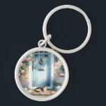 Cottagecore Blommigt Porch med Calico Cat Rund Silverfärgad Nyckelring<br><div class="desc">Den här charmerande teckningen fångar kärnan av cottagecore-estetik med en scen som är inställd före en pastellblå dörr som ramas av att blomma rosa ros och prickad lavender. En katt av kalico-typ i innehåll hänger sig fredligt vid infarten och tillför en mysigt, levande beröring som framkallar värmen i en långsam...</div>