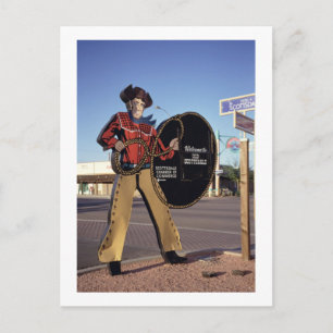 Cowboy figur-skylt som hälsar turister välkomna ti vykort