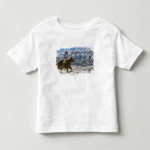 Cowboy på häst iklädd läderchaps t shirt