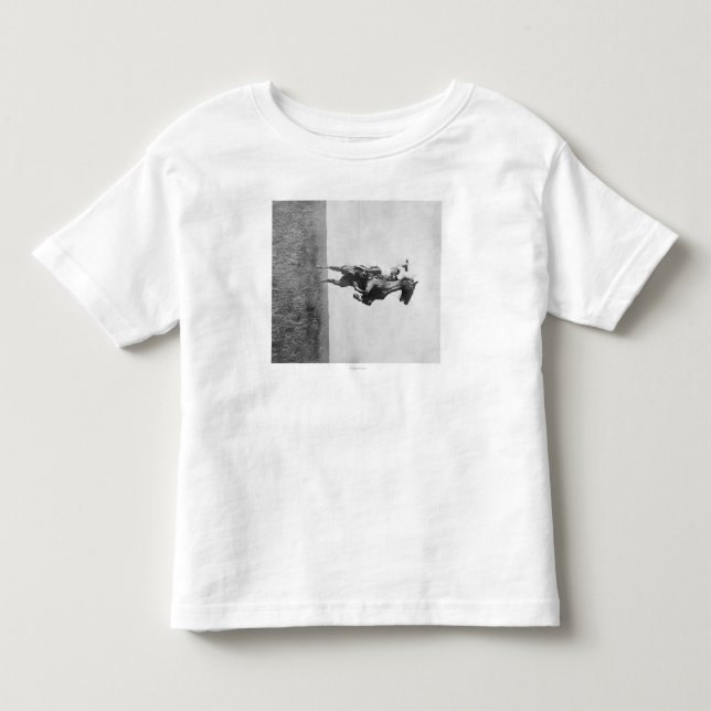 Cowboy Rides Bronco Stigning på sitt Hing Ben T Shirt (Framsida)