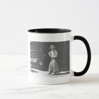 Cowboy som äter från en Peter Pan peanutbutter Mugg