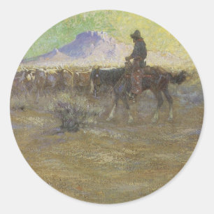 Cowboy som driver boskap på betesmark av Lon Megar Runt Klistermärke