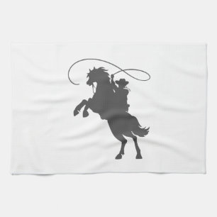 cowboy som kastar lasso och rider upp häst kökshandduk