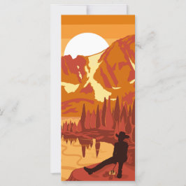 Cowboy vid solnedgången i bergen