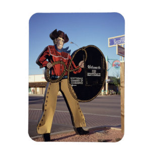 Cowboyfiguren undertecknar välkomnas turister til magnet