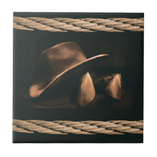 Cowboyhatt, kängor och manlig western stil för r kakelplatta