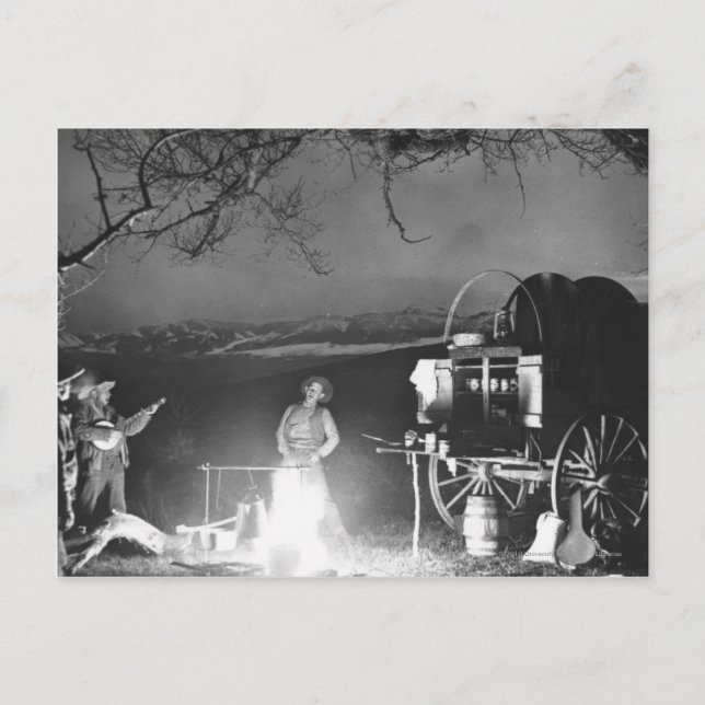 Cowboys leker och sjunger runt en campfire vykort (Framsida)