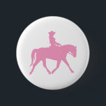 Cowgirl Riding Her Horse (rosa) Knapp<br><div class="desc">Cowgirl Riding Her Horse (rosa) t-shirts, shirts, kläder och presenter har en silhuettbild av en cowgirl som rider hennes häst. Underbar grafik för cowgirl och cowboyerna som kärlek dem! Många olika skjortor stilar och färger att välja mellan i för manar storlekar, kvinnor, barn, vuxnor. Finns på roligtens presentartiklar och klistermärken,...</div>