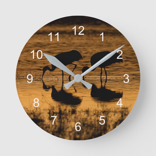 Cranes Silhouetted by the Sunset Rund Klocka (Framsida)