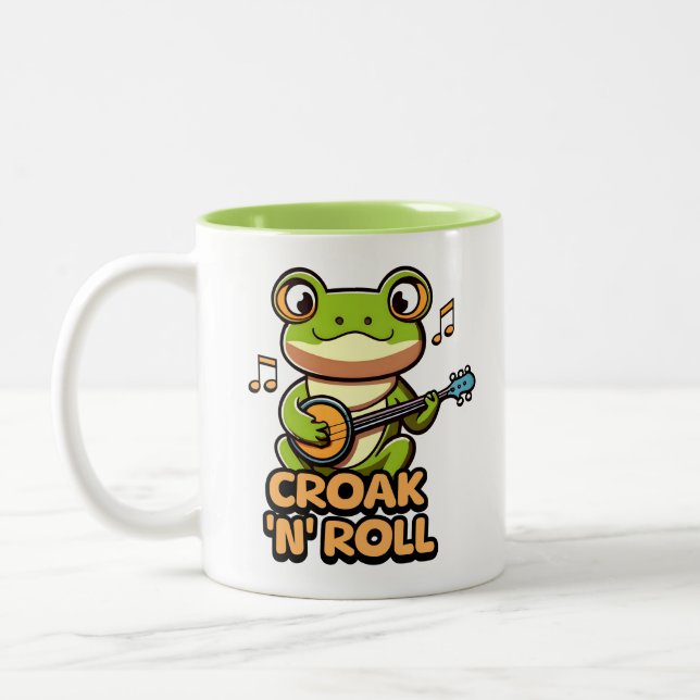 Croak 'N' Roll. Cute Banjo Pay Frog Tecknad Två-Tonad Mugg (Vänster)