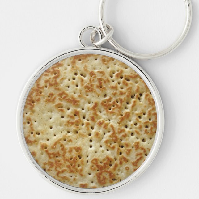 Crumpet Rund Silverfärgad Nyckelring (Framsidan)