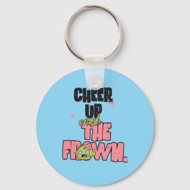 CRUSH THE FROWN CHEER UP ROUND METAL KEYCHAIN  NYCKELRING (Framsida)