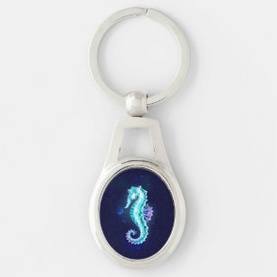 Crystal Ice Seahorse on Blue Background Ovalt Silverfärgad Nyckelring