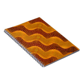 Curva laranja e pontos dourados sobre fundo marrom anteckningsbok