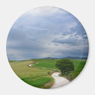 Curvy väg in mot en destinationsrundamagnet magnet