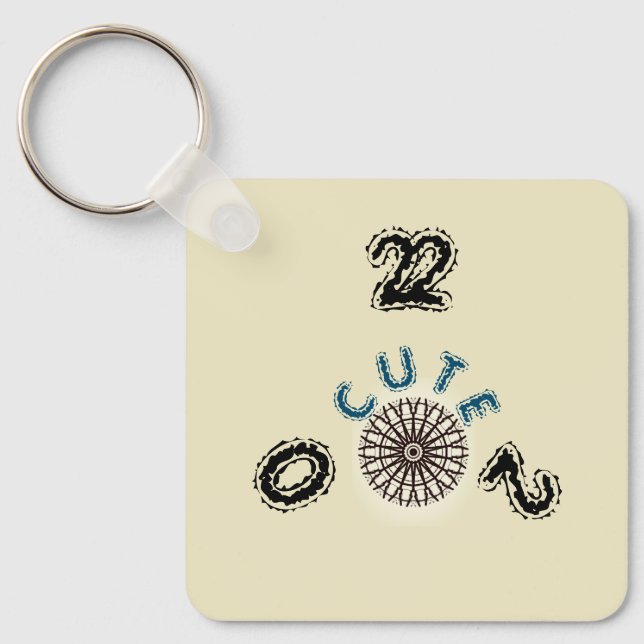 CUTE_2022_ BLACK OCH BROWN LIGHT-GULT_Aluminium Nyckelring (Framsida)