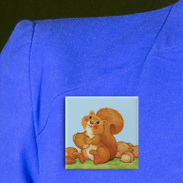 Cute Adworthy Nöt Knapp (Cute red squirrel licking his lips in grass with acorns under blue sky on square pin back button.)