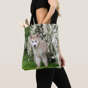 Cute Alaska Malamute Hund Puppy in Flowers Photo Tygkasse
