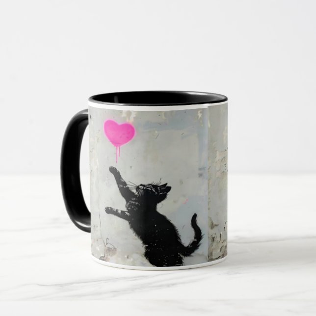 Cute Black Cat Playing with A Pink Heart Mugg (Framsida vänster)