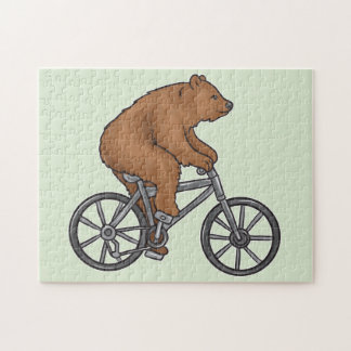 Cute Brown Bear Riding A Bike Pussel