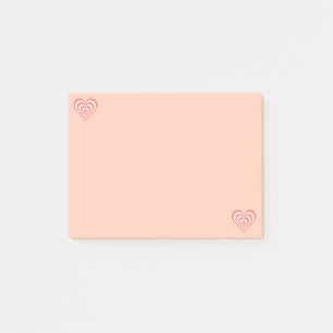 Cute coral rosa och vita hjärtan på ljusa rosa post-it block