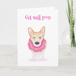 Cute Corgi med en nacke-donut får ett bra kort