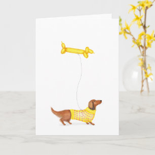Cute dachshund med ballongkort för korv av hund kort