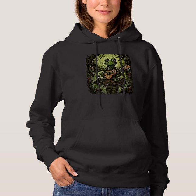 Cute Frog Playing Guitar Next To A Pond Men Women  T Shirt (Framsida)