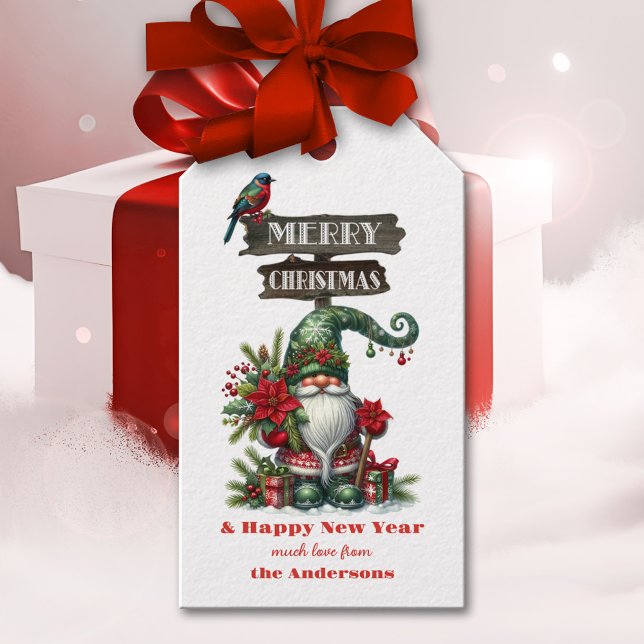Cute Gnome God jul Presentetikett (Cute Christmas gift tag showing an illustration of a festive gnome with colorful bird and poinsettia)