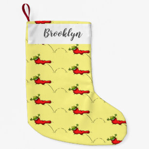 Cute grog i en röd sockhoppande tecknad liten julstrumpa