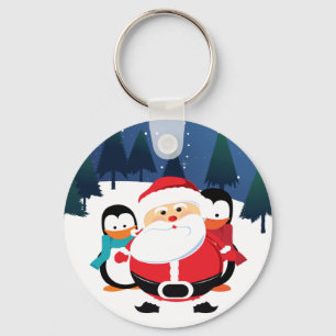 Cute Jultomten och penguin i vinterscen Nyckelring