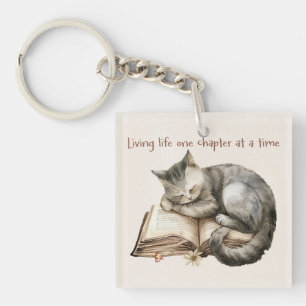 Cute Kitten Sleeping on Open Bok Gift