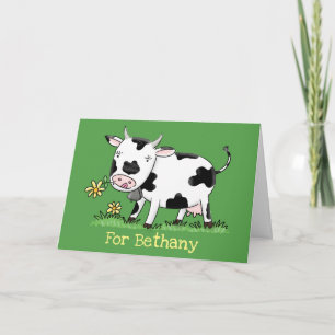 Cute kon i grönt fält tecknad illustration kort