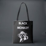 Cute Little Black Monkey Tygkasse<br><div class="desc">Meet your new favorite jungle friend! This adorable peeking monkey design features a clean,  white illustration that pops perfectly on dark fabrics. A fun and playful choice for kids,  wildlife enthusiasts,  or anyone who loves a bit of monkey business.</div>