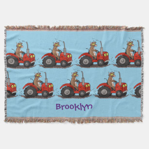 Cute lycklig ko som kör en röd traktortecknad filt