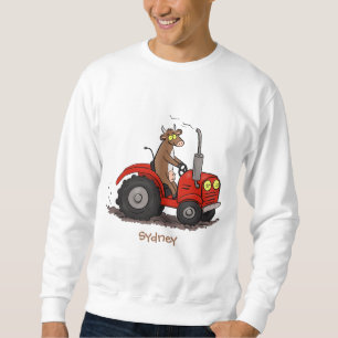 Cute lycklig ko som kör en röd traktortecknad lång ärmad tröja