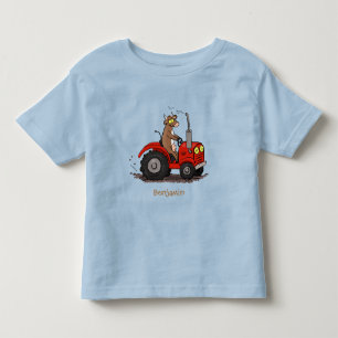 Cute lycklig ko som kör en röd traktortecknad t shirt