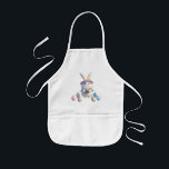 Cute Påskhare 01 Barnförkläde<br><div class="desc">Fira Påsk med den här vackra, fluffa vita bunny som håller en fullt basket av färgstarka Påskägg! Omgiven av en magisk atmosfär i vår, fångar denna charmerande illustration säsongens glädje och värme. 🌸 Perfekt för hälsning, gåvor och dekorationer från Påsk! Oavsett om du skickar önskemål eller tittar för perfektens festliga...</div>