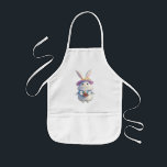 Cute Påskhare 01 Barnförkläde<br><div class="desc">Fira Påsk med den här vackra, fluffa vita bunny som håller en fullt basket av färgstarka Påskägg! Omgiven av en magisk atmosfär i vår, fångar denna charmerande illustration säsongens glädje och värme. 🌸 Perfekt för hälsning, gåvor och dekorationer från Påsk! Oavsett om du skickar önskemål eller tittar för perfektens festliga...</div>