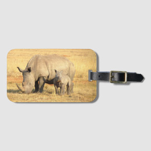 Cute rhinoceros i afrika bagagebricka