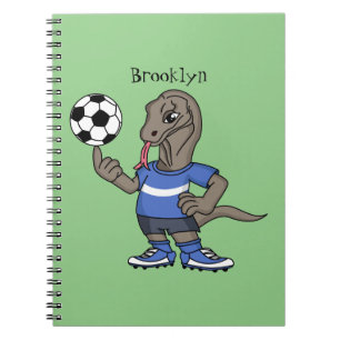 Cute roligt Komodo draon spelar fotboll tecknad Anteckningsbok