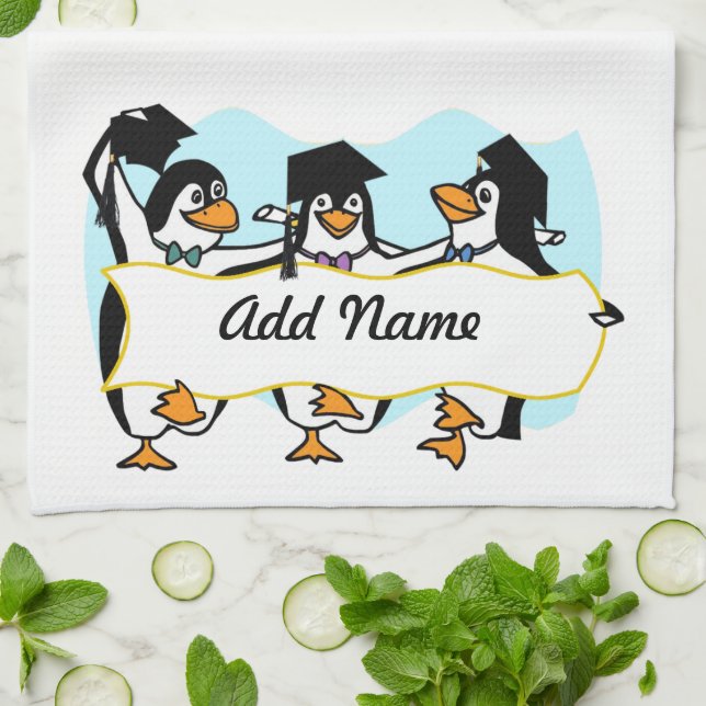 Cute Tecknad Graduating Penguins w/Banner Kökshandduk (Vikta)